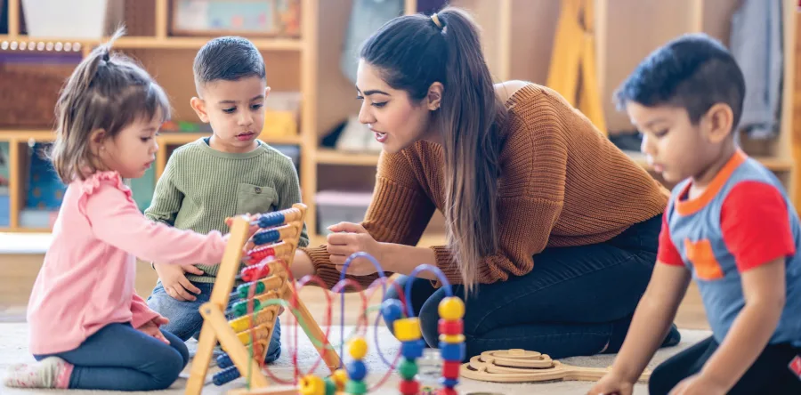 child care provider playing with kids